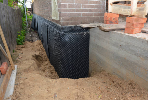 Happy homeowners after waterproofing job in Takoma Park